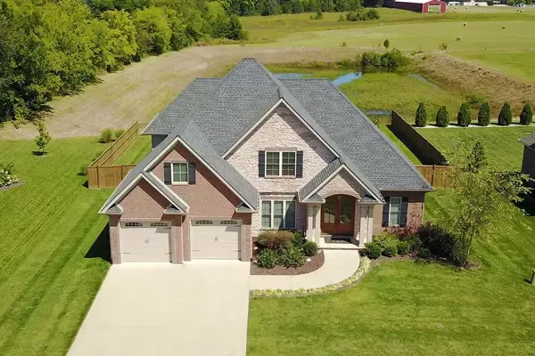Aerial view of a contemporary brick home with a double garage
