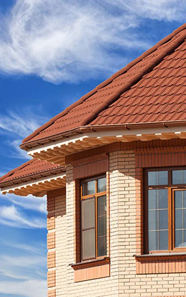 Teaneck Roof with red tiles and brick wall
