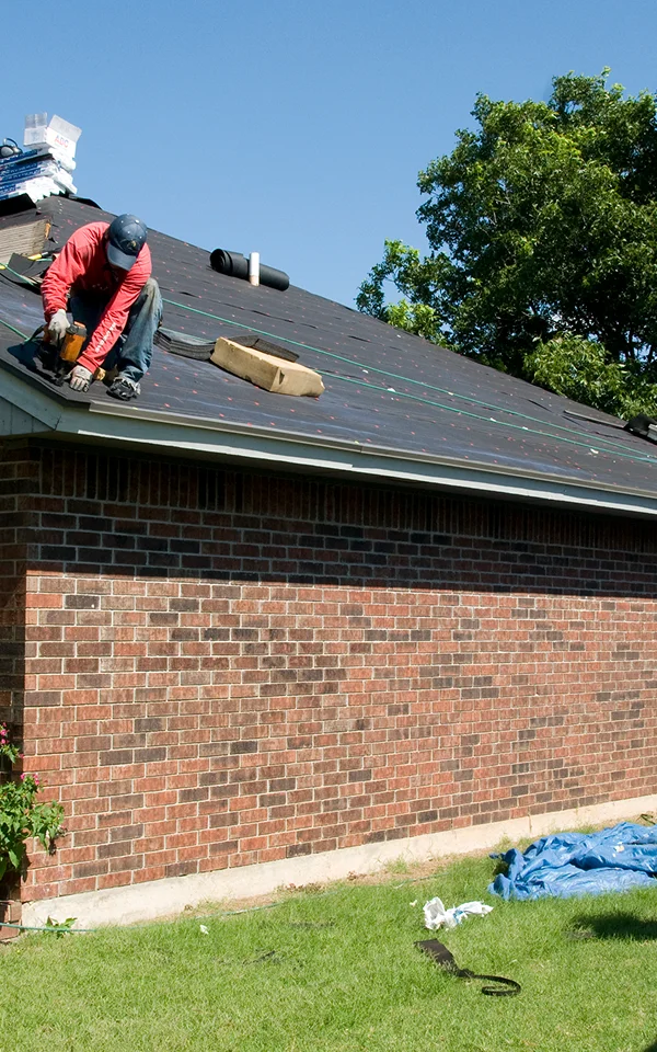 Passaic Roofer installing shingles on a residential roof