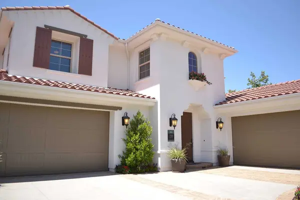 Two-story house with a red tile roof