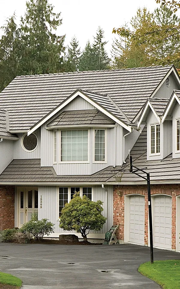 Bergen Two-story house with gray siding and brick accents