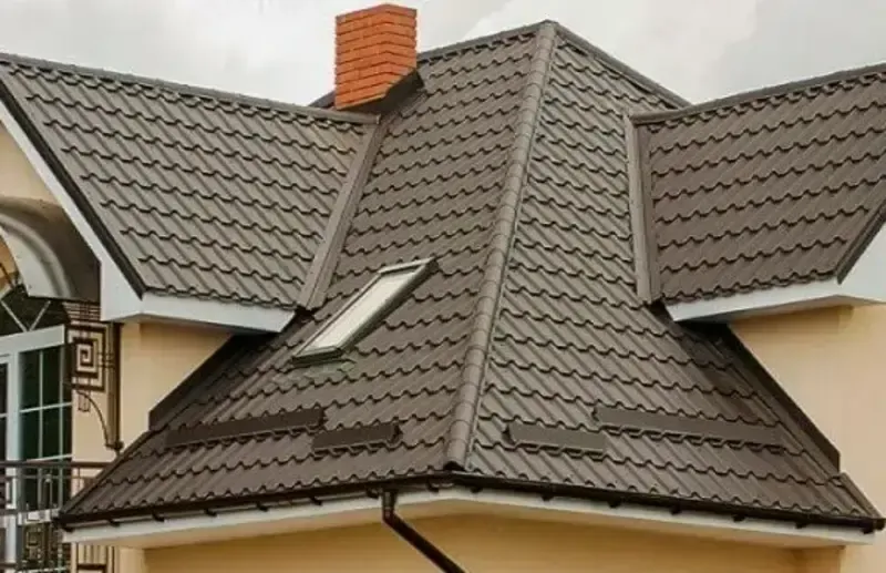 Clifton Brown tiled roof with a chimney and skylight